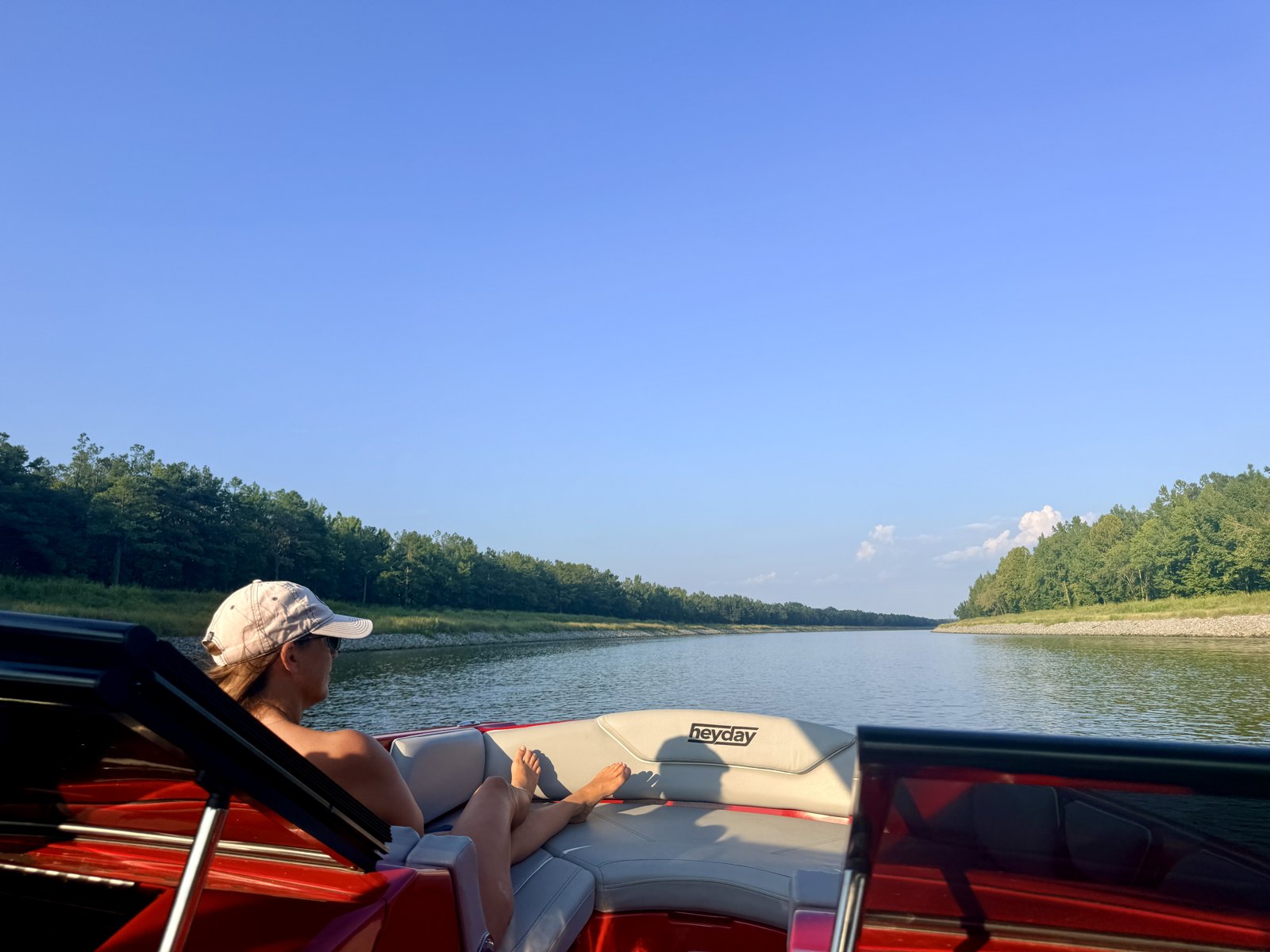 Jenny relaxing on the Heyday's bow in the straight riprap-lined cut of the Tennessee-Tombigbee Waterway